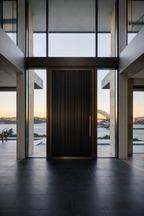 Cast aluminium pivot door interior front view
