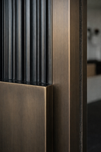 Cast aluminium pivot door frame and panel detail
